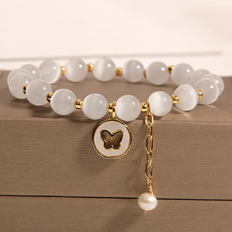 Pulsera de amor con dije de mariposa y ojo de gato con Buddha Stones