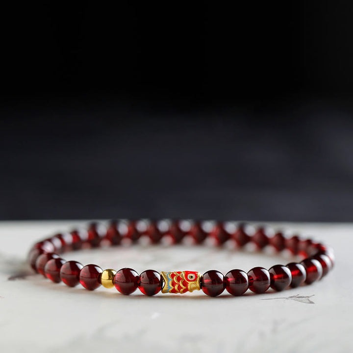 Pulsera de protección con granate natural y pez Koi de oro 999 de Buddha Stones - image 3
