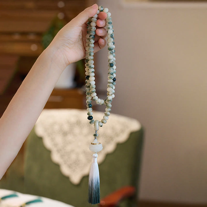 Buddha Stones Natural 108 cuentas Mala semilla Bodhi loto grabado sabiduría borla pulsera