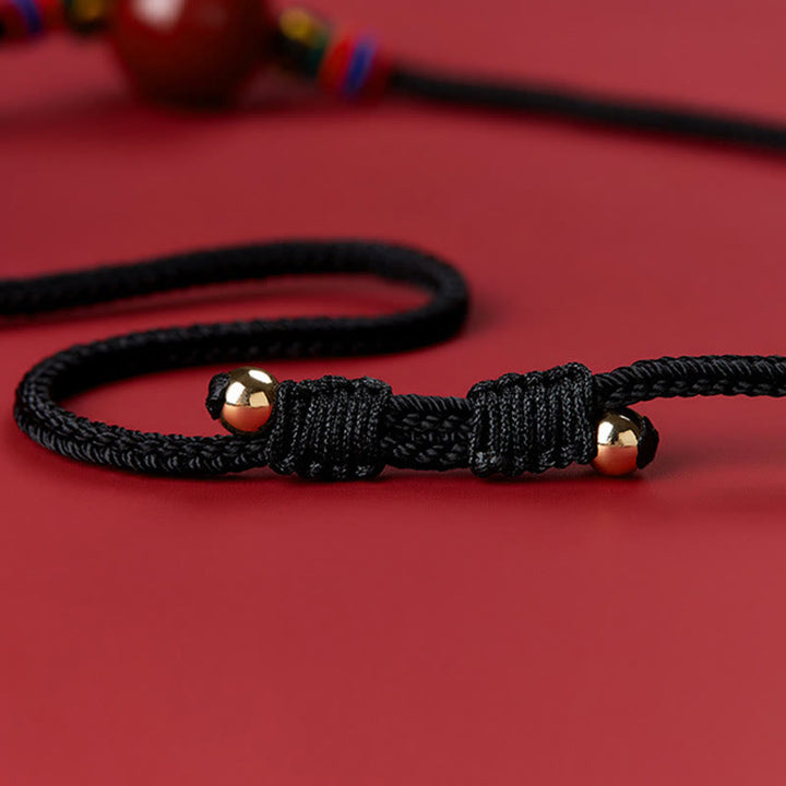 Collar con colgante de cadena con cuentas de cinabrio y Buddha Stones
