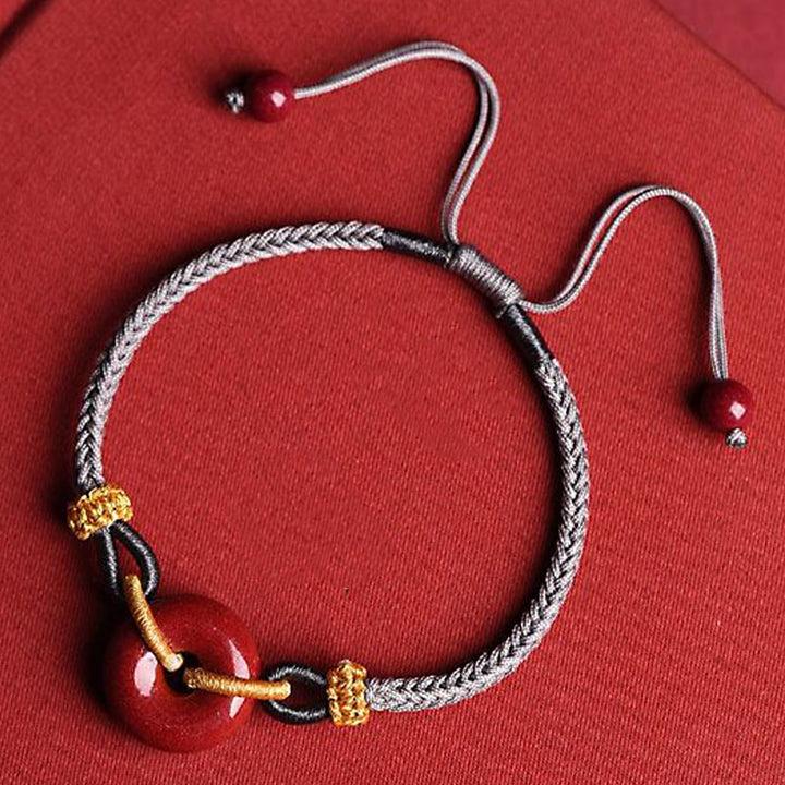 Pulsera de cuerda trenzada con hebilla de paz de cinabrio hecha a mano con Buddha Stones