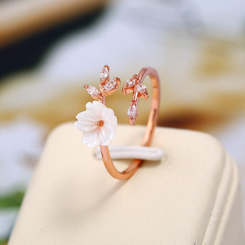 Anillo de la suerte de cobre con diseño de hojas de flor de ciruelo y Buddha Stones