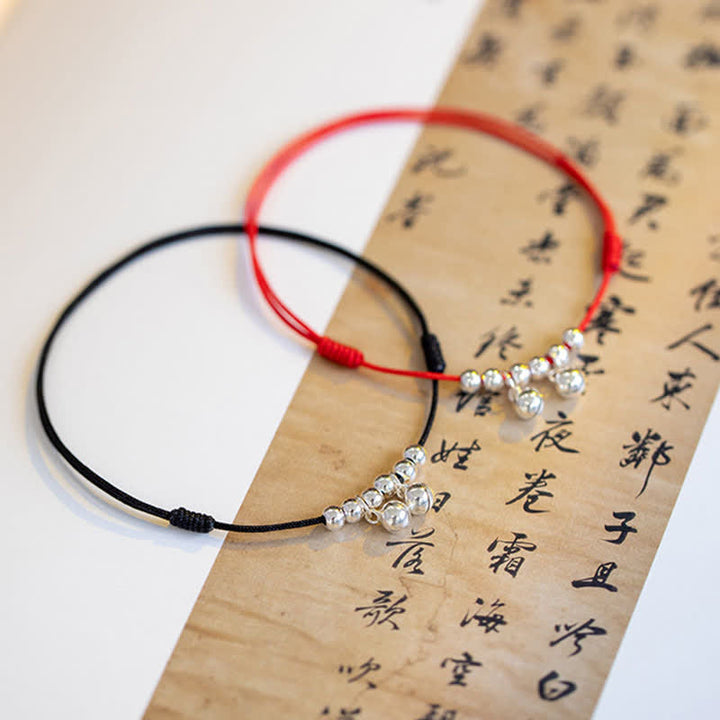 Tobillera con dije de campana trenzada con hilo rojo de plata de ley 925 con Buddha Stones