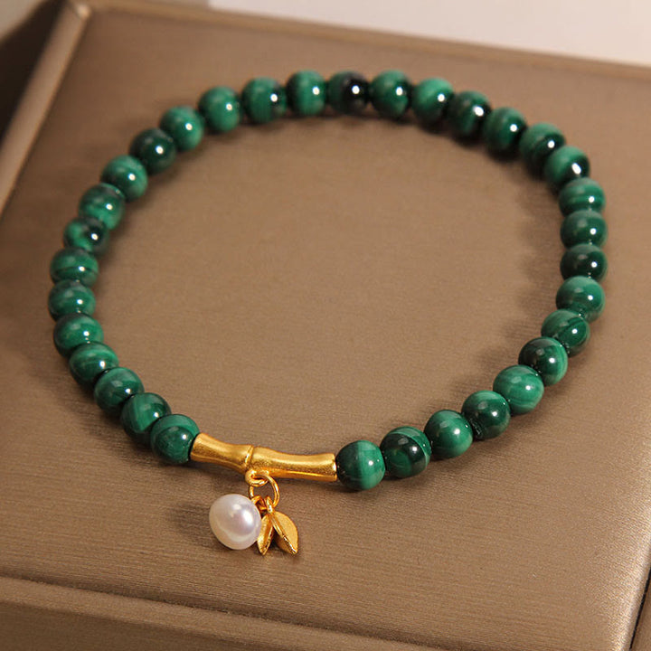 Pulsera antiansiedad de bambú de la suerte con perlas de malaquita natural de Buddha Stones