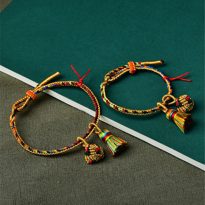 Pulsera con dije de bola dorada Zongzi hecha a mano con cuerda colorida y Buddha Stones