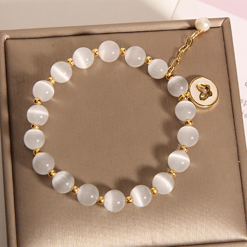 Pulsera de amor con dije de mariposa y ojo de gato con Buddha Stones