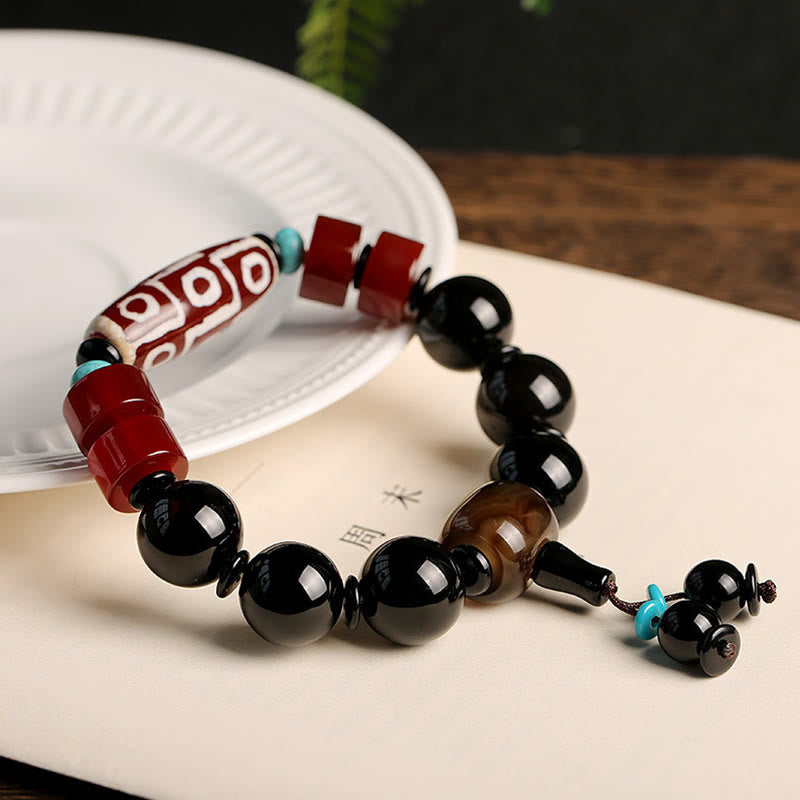 Pulsera tibetana de protección de la riqueza de ónix negro con cuentas Dzi de nueve ojos