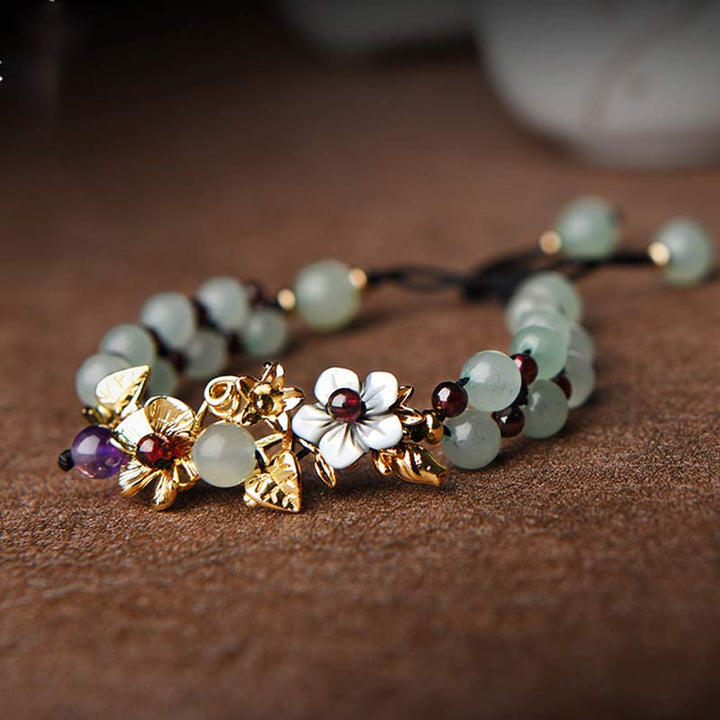 Pulsera de la suerte con pétalos de flores y cuentas de granate y aventurina verde con Buddha Stones