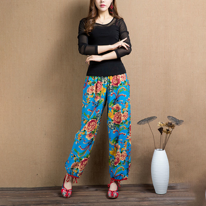 Pantalones bombachos con estampado de flores rojas y verdes de estilo étnico con Buddha Stones y bolsillos