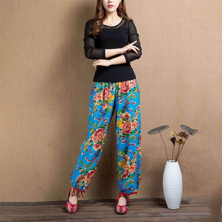 Pantalones bombachos con estampado de flores rojas y verdes de estilo étnico con Buddha Stones y bolsillos