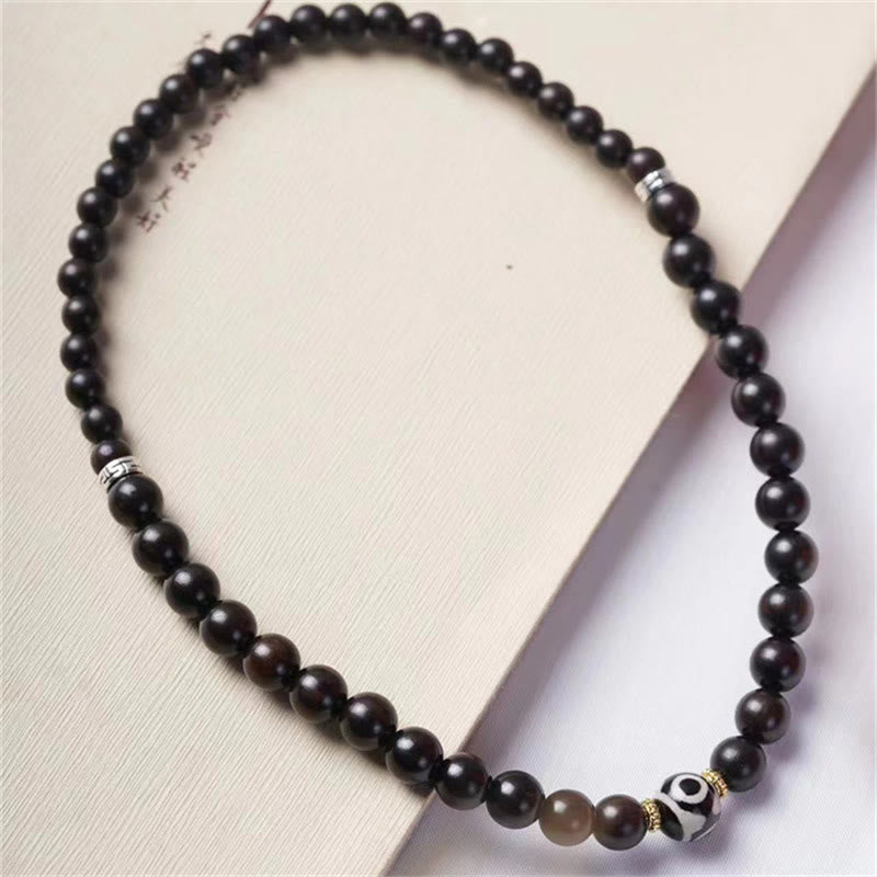Pulsera de doble envoltura con cuentas Dzi de madera de ébano del Tíbet con Buddha Stones