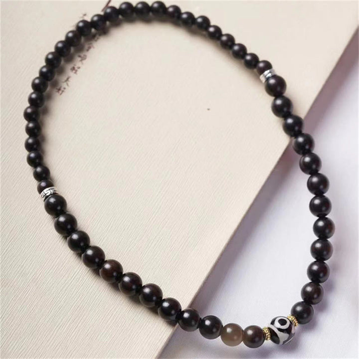 Pulsera de doble envoltura con cuentas Dzi de madera de ébano del Tíbet con Buddha Stones