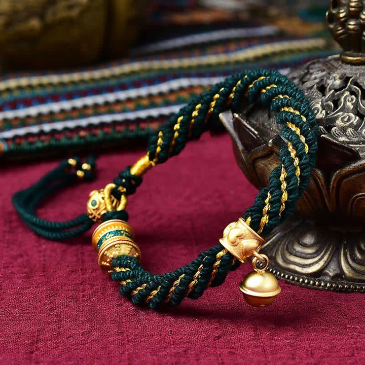 Pulsera de cuerda trenzada con dije de campana y rueda de oración Thangka de protección de la suerte hecha a mano tibetana
