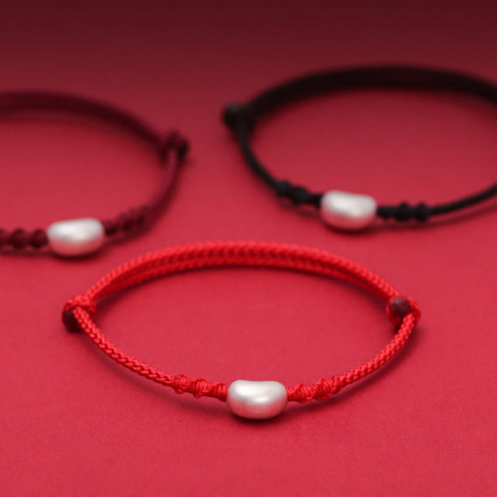 Pulsera trenzada hecha a mano con diseño de frijol de plata de ley 999 con Buddha Stones
