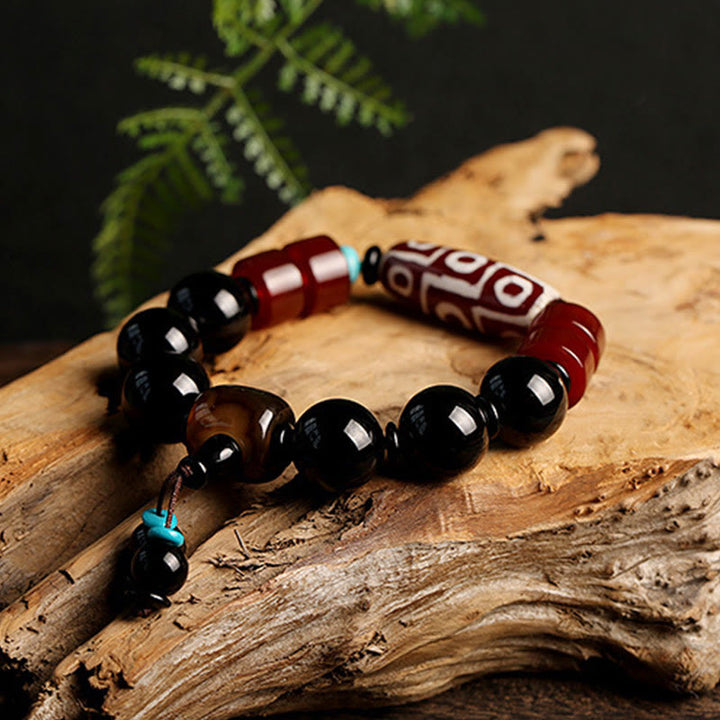Pulsera tibetana de protección de la riqueza de ónix negro con cuentas Dzi de nueve ojos