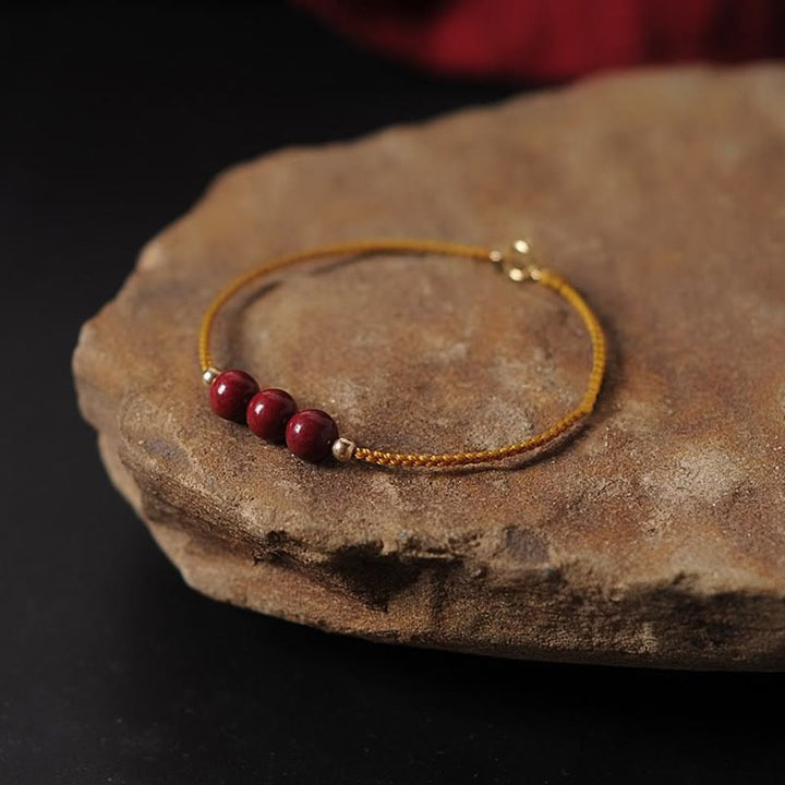 Pulsera trenzada con cadena de bendición de cinabrio natural chapada en oro de 14 quilates con Buddha Stones