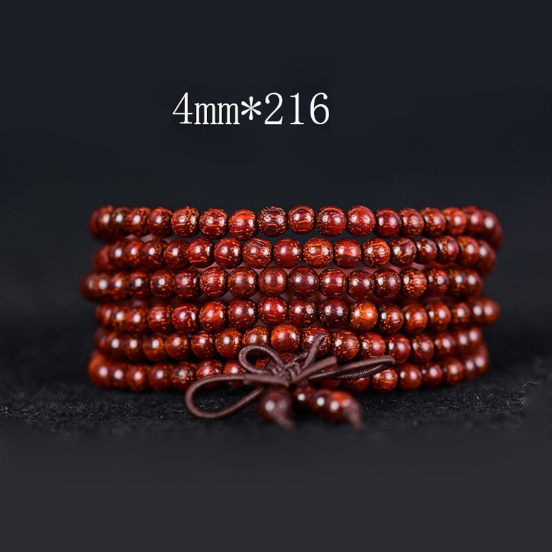 Pulsera de equilibrio de sándalo rojo con hoja pequeña tibetana de Buddha Stones