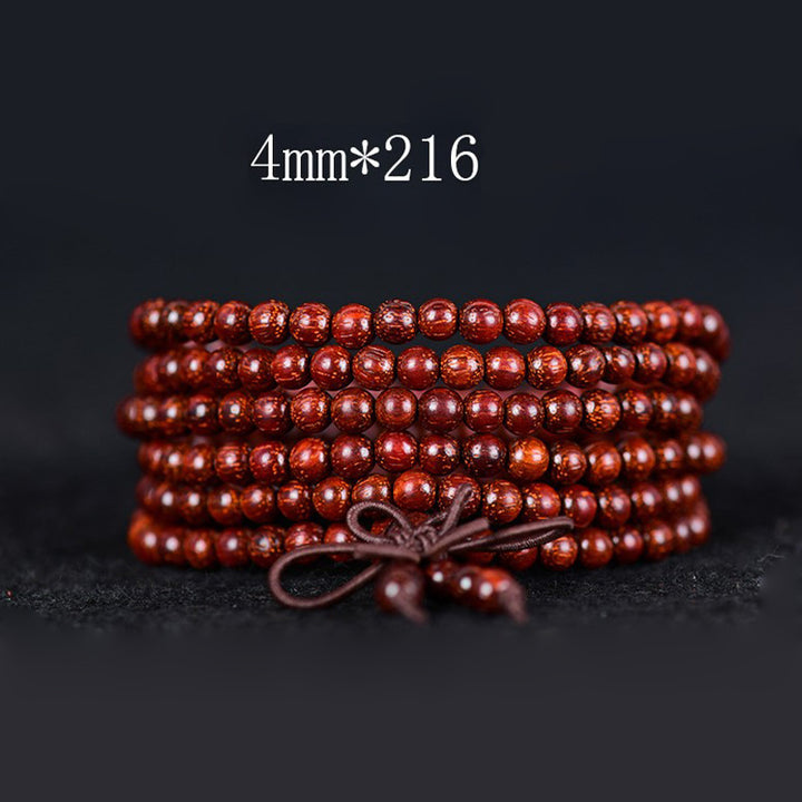 Pulsera de equilibrio de sándalo rojo con hoja pequeña tibetana de Buddha Stones