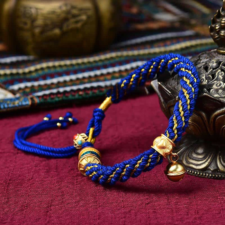 Pulsera de cuerda trenzada con dije de campana y rueda de oración Thangka de protección de la suerte hecha a mano tibetana