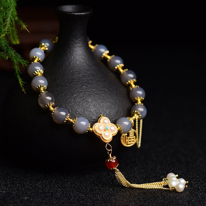 Pulsera de equilibrio con borlas y perlas de carácter Fu de ágata gris natural con Buddha Stones