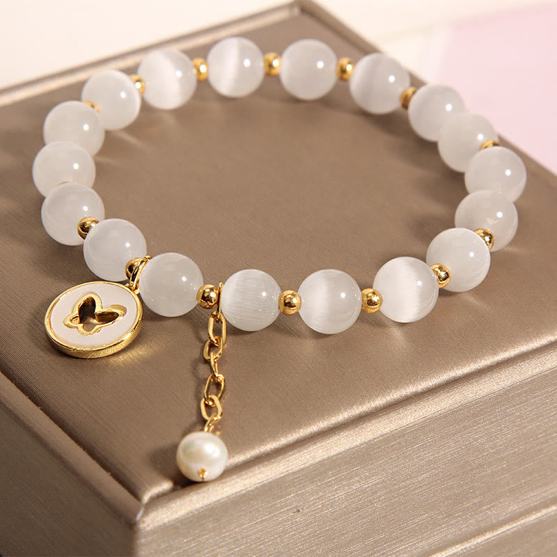 Pulsera de amor con dije de mariposa y ojo de gato con Buddha Stones