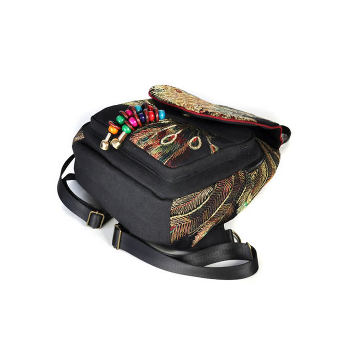 Mochila con borlas de lona con bordado de pavo real