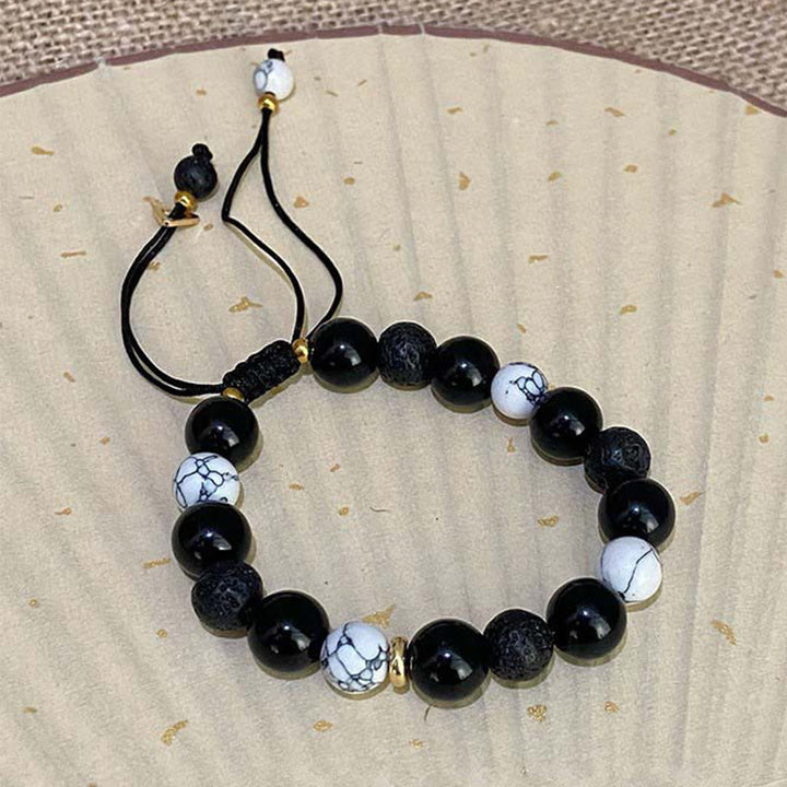 Pulsera de fuerza Yin Yang de piedra de roca de lava de obsidiana negra con Buddha Stones