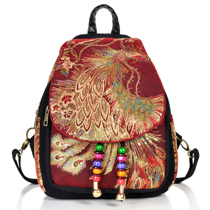 Mochila con borlas de lona con bordado de pavo real