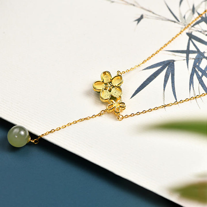 Colgante de collar de la suerte con diseño de flor de ciruelo de jade cian hetiano de plata de ley 925 con Buddha Stones