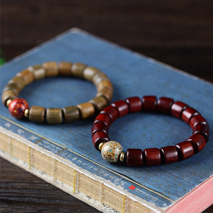 Pulsera de la paz con cuentas de laca de sándalo rojo de hoja pequeña de sándalo verde natural con Buddha Stones