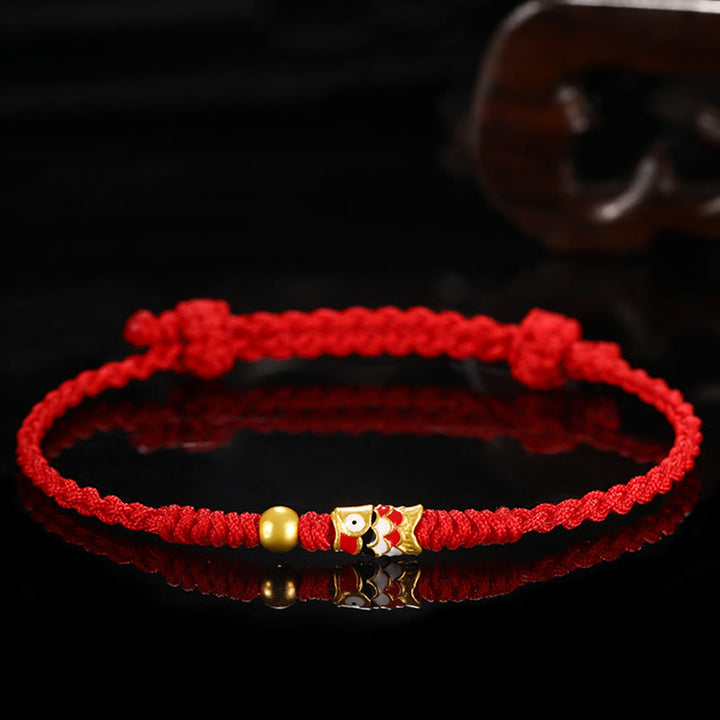 Pulsera de hilo trenzado hecha a mano con pez Koi de la suerte de oro 999 de Buddha Stones