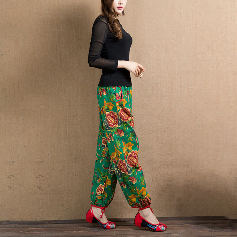 Pantalones bombachos con estampado de flores rojas y verdes de estilo étnico con Buddha Stones y bolsillos