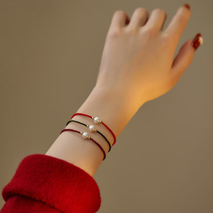 Pulsera de hilo trenzado de la suerte con cuentas de perlas naturales de piedras de Buddha Stones