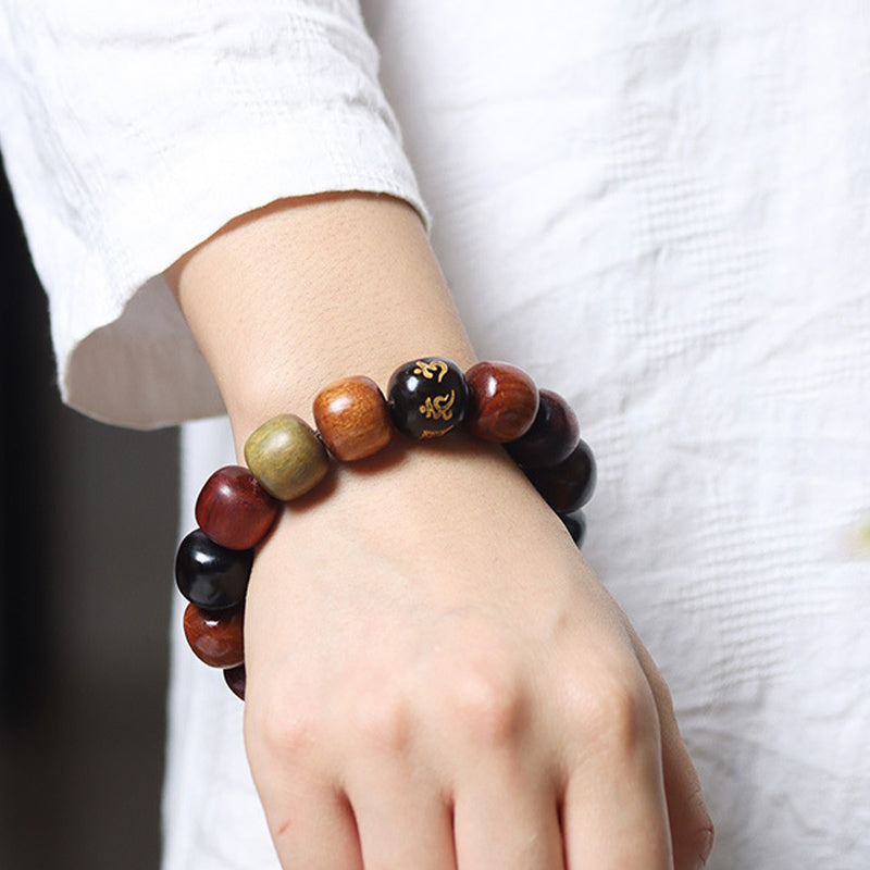 Pulsera de pureza Om Mani Padme Hum de varias maderas del Tíbet con Buddha Stones
