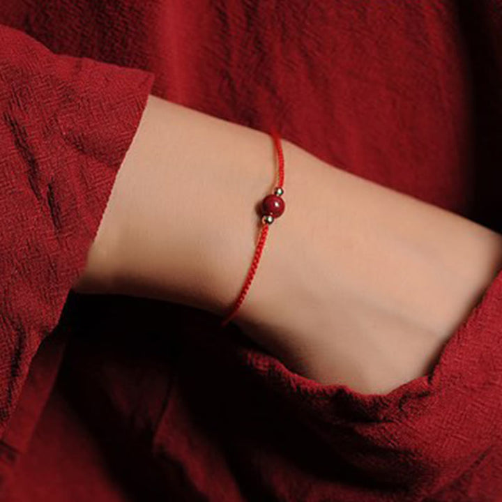 Pulsera trenzada con cadena de bendición de cinabrio natural chapada en oro de 14 quilates con Buddha Stones