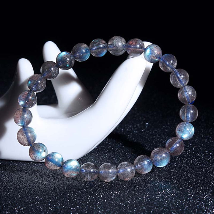 Pulsera de cuentas curativas de piedra lunar natural de piedras de Buddha Stones - image 10
