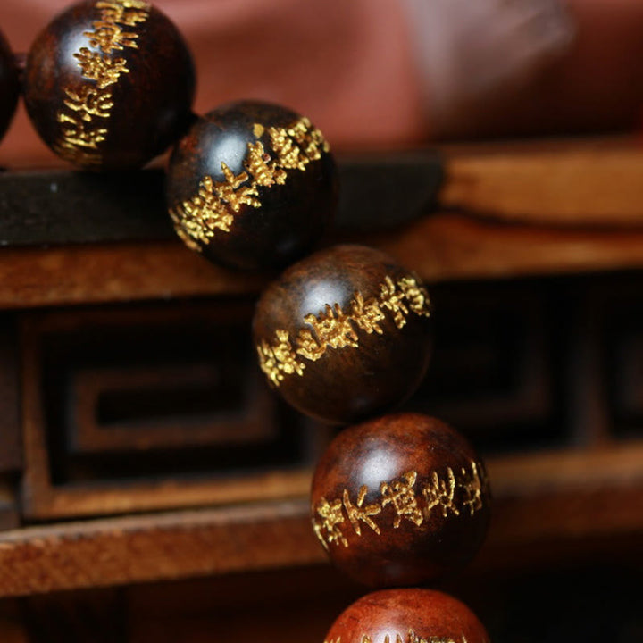 Pulsera de curación grabada con sutra de corazón de palisandro tibetano