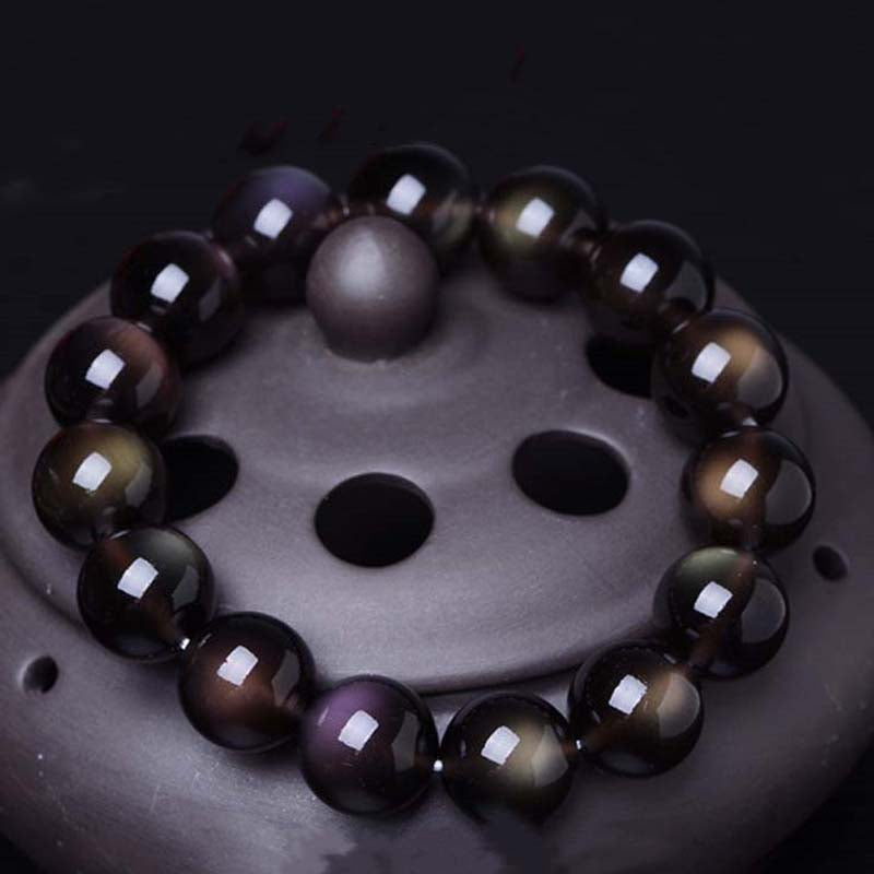 Pulsera positiva de obsidiana arcoíris natural con Buddha Stones