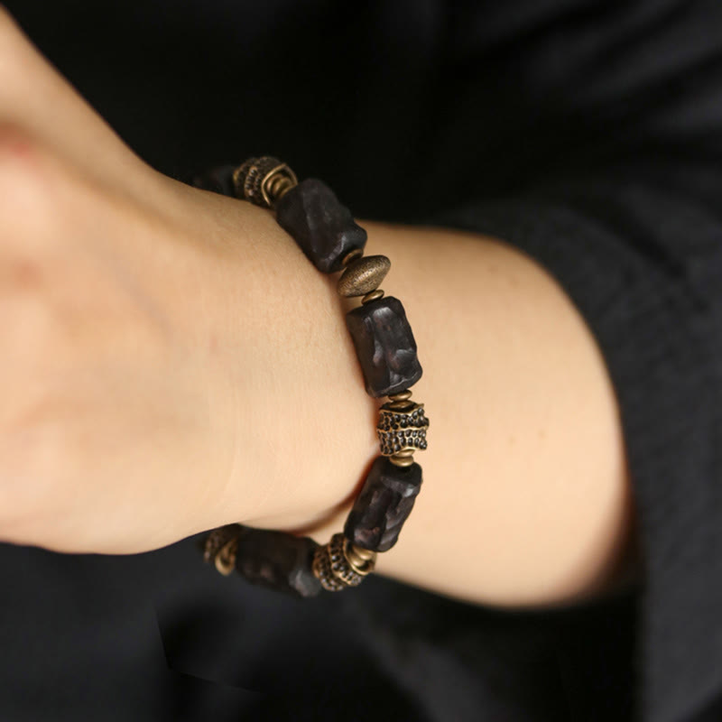 Pulsera de paz tranquila de cobre y madera de ébano tibetano con Buddha Stones