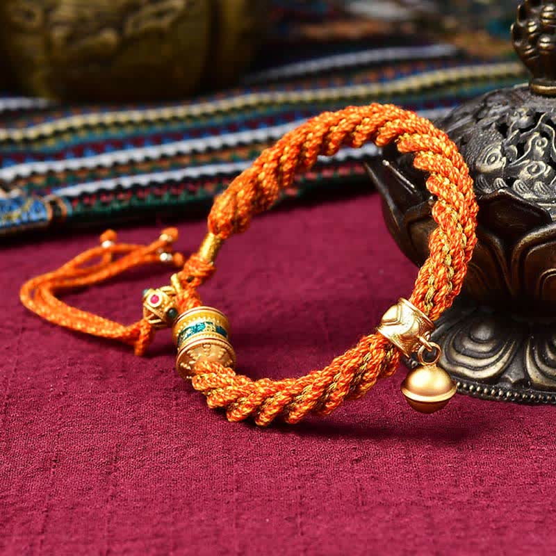Pulsera de cuerda trenzada con dije de campana y rueda de oración Thangka de protección de la suerte hecha a mano tibetana
