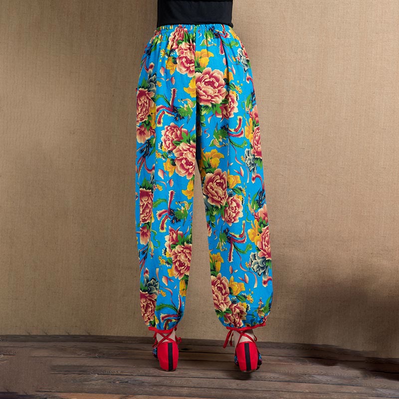 Pantalones bombachos con estampado de flores rojas y verdes de estilo étnico con Buddha Stones y bolsillos
