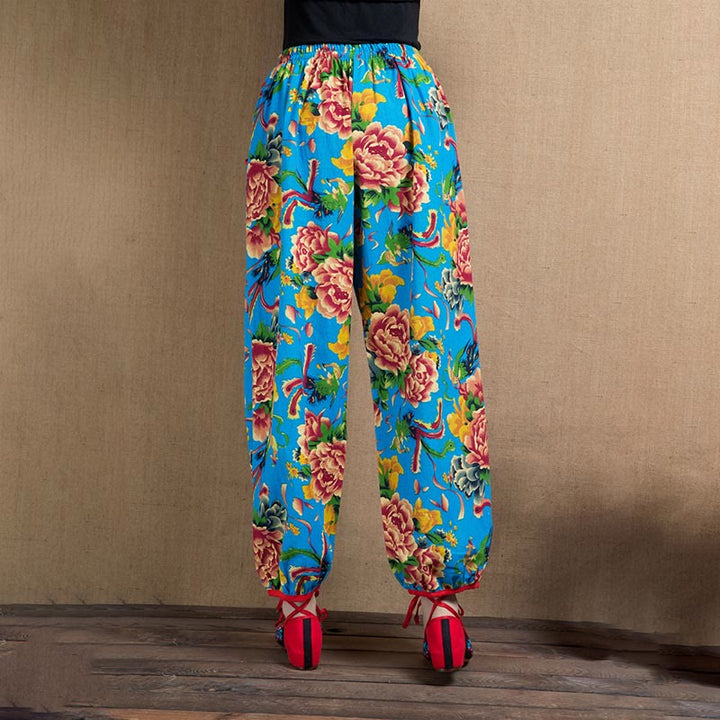 Pantalones bombachos con estampado de flores rojas y verdes de estilo étnico con Buddha Stones y bolsillos