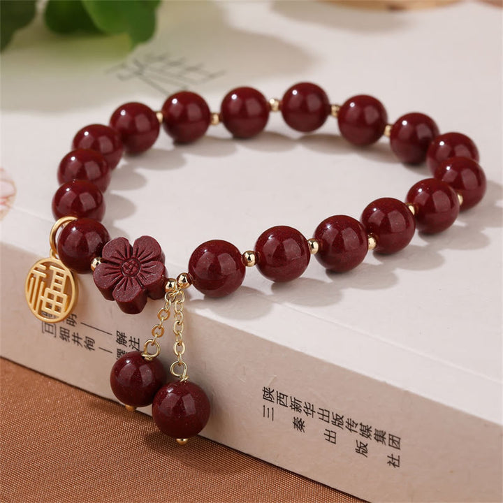 Pulsera de bendición de flor de cerezo con personaje de cinabrio de Buddha Stones