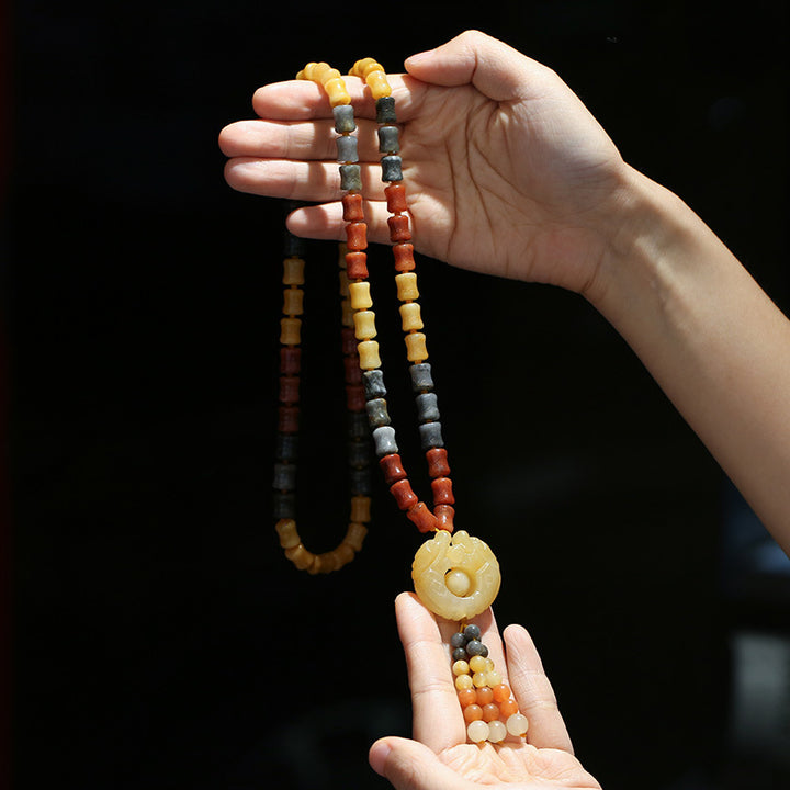 Collar con colgante de riqueza de jade de seda dorada tibetana con Buddha Stones