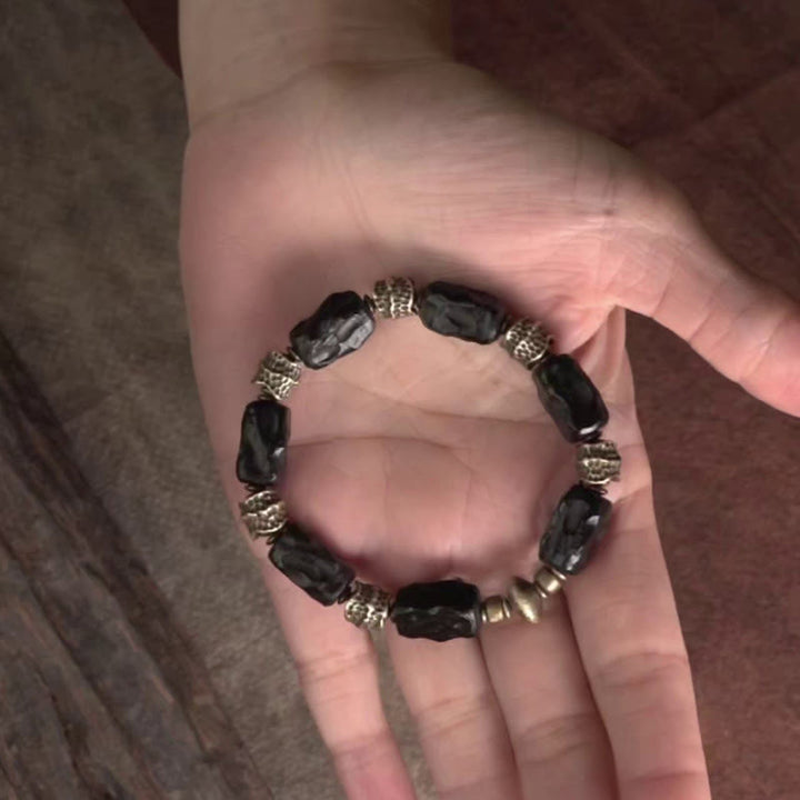 Pulsera de paz tranquila de cobre y madera de ébano tibetano con Buddha Stones