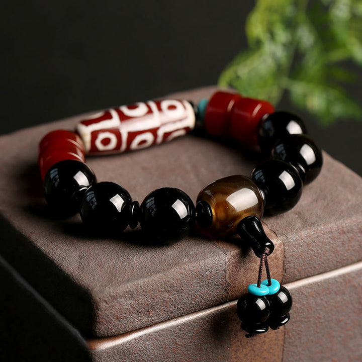 Pulsera tibetana de protección de la riqueza de ónix negro con cuentas Dzi de nueve ojos