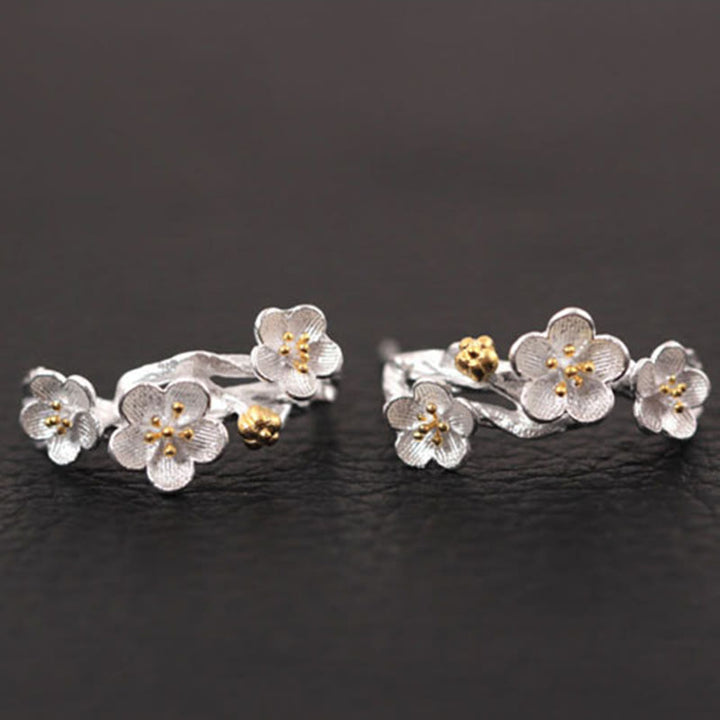 Pendientes de bendición floral de flor de ciruelo de plata de ley 925 con Buddha Stones