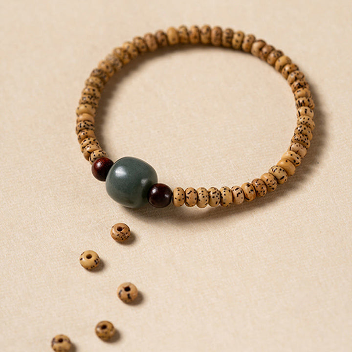 Pulsera de sabiduría de sándalo rojo con hojas pequeñas y semillas de Bodhi de Buddha Stones