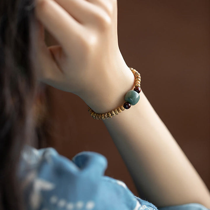 Pulsera de sabiduría de sándalo rojo con hojas pequeñas y semillas de Bodhi de Buddha Stones