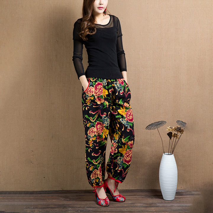 Pantalones bombachos con estampado de flores rojas y verdes de estilo étnico con Buddha Stones y bolsillos
